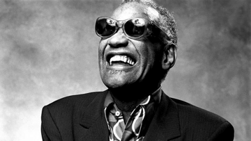Black and white image of musician Ray Charles smiling