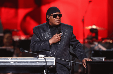 Famous blind Grammy winner musician Stevie Wonder on stage