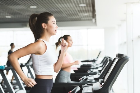 woman on treadmill in gym